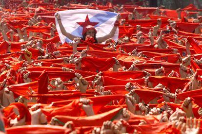 Hundreds of red handkerchiefs are waved at the San Fermín fiestas in 2000, moments before the ‘chupinazo’ is fired.