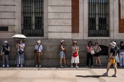 Tourists in Madrid's landmark Puerta del Sol square.