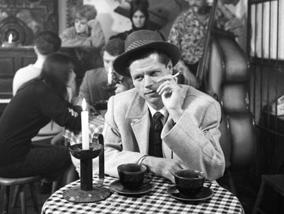 Model Terry Brook poses in a café on Brompton Road, London, in 1959.