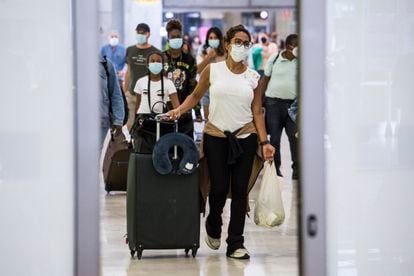 Passengers arriving in Madrid's Barajas Airport on Monday.