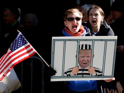 Anti-Trump demonstrators protest outside the Manhattan District Attorney's office in New York City on March 21, 2023.