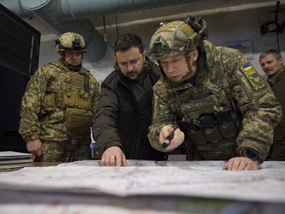 Ukrainian President Volodymyr Zelenskiy (C) taking part in a meeting with commanders at the headquarters of the Defense Forces near a frontline close to Kupiansk, Ukraine, November 30 2023.