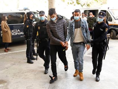 Two of the arrested passengers are brought before a judge in Palma on Monday.