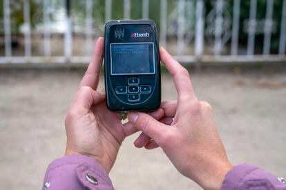 Alicia (not her real name) shows the device that warns her when her ex-partner is less than 500 meters from her.