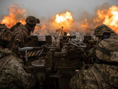 Ukrainian soldiers fire at Russian positions on the front lines near Bakhmut in the Donetsk region; January 15, 2023.
