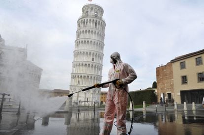 Disinfection work near the Tower of Pisa, in Pisa, Italy, in a file photo from March 2020.