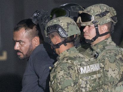 Jorge Iván Gastélum, aka El Cholo Iván, is escorted to a federal hangar in Mexico City, on January 8, 2016.