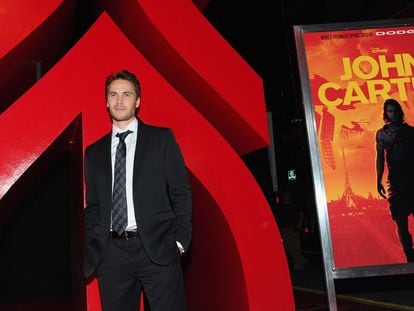 Actor Taylor Kitsch posing for the media at the premiere of 'John Carter' in L.A. on February 22, 2012.