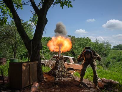 A Ukrainian soldier fires a mortar at Russian positions on the frontline near Bakhmut, Donetsk region, Ukraine, Monday, May 29, 2023.