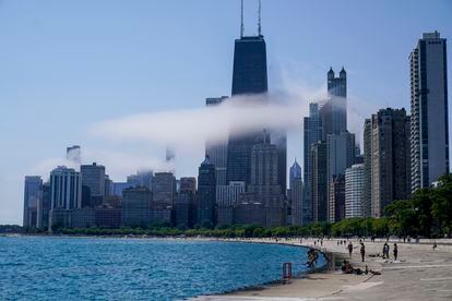 The Chicago city skyline is covered by the fog lifted off Lake Michigan on August 5, 2022, in Chicago.