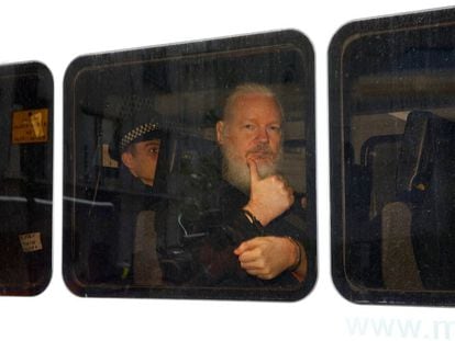Julian Assange inside a police van after his arrest on April 11.