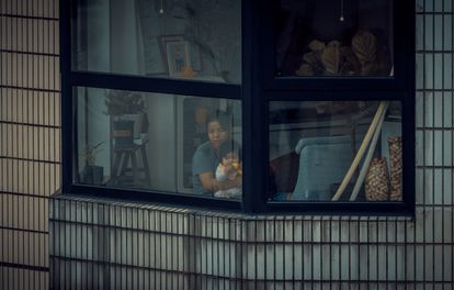 A woman and her child in lockdown in an apartment in Shanghai on April 27.
