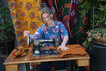 Maica de la Carrera, the MAMAH AFRICA designer, makes a garment from wax fabrics.