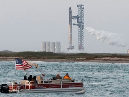 Spectators watch from a boat before SpaceX's Starship lifts off from the company's Boca Chica launchpad on an orbital test mission near Brownsville, Texas, on April 17, 2023.