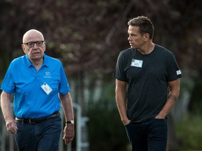 Rupert Murdoch and his son Lachlan Murdoch walk together, on July 13, 2017, in Sun Valley, Idaho.