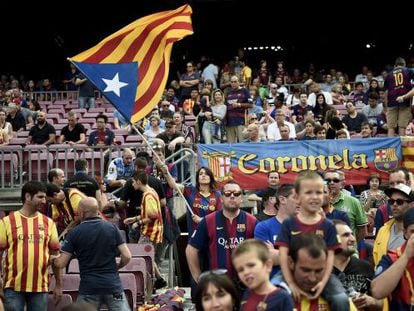 A Barça fan waves an ‘estelada’ Catalan nationalist flag at Camp Nou.