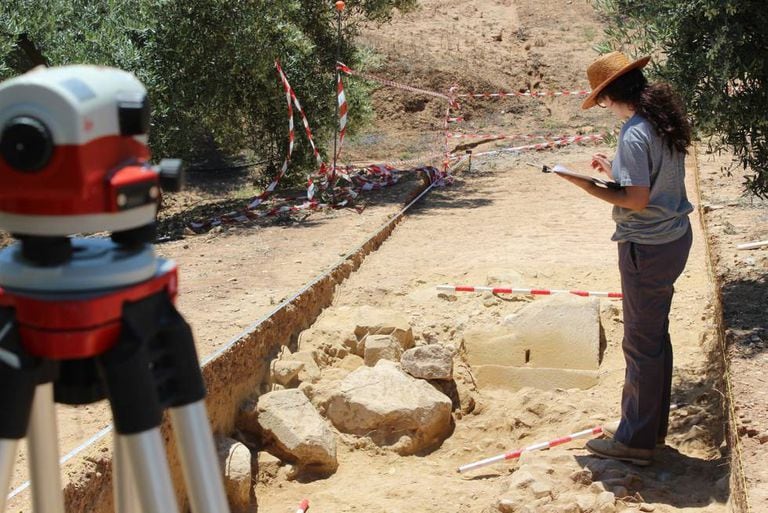 A researcher at the remains of the Janus Augustus Arch.