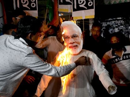 Supporters of opposition party National Congress burn an effigy of Indian Prime Minister Narendra Modi during a protest campaign, in Kolkata, India, on March 24, 2023.