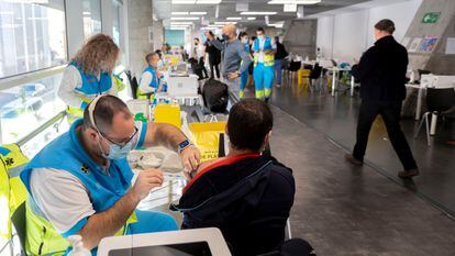 People getting vaccinated against Covid-19 at the WiZink Center in Madrid on January 20.