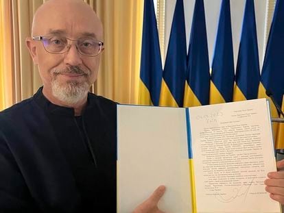 In this photo provided by the Ukrainian Parliament Press Office, Ukrainian Minister of Defense Oleksii Reznikov shows his resignation letter addressed to the Parliamentary Speaker in Kyiv, Ukraine, Monday, Sept. 4, 2023