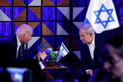 Joe Biden speaks with Israeli Prime Minister Benjamin Netanyahu in Tel Aviv on October 18.