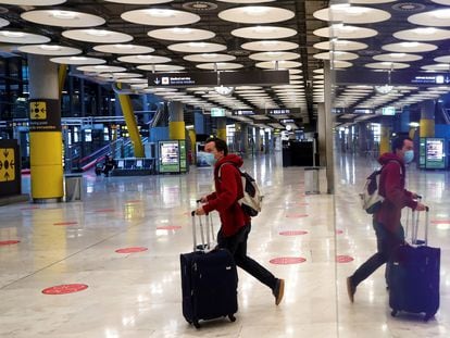 A traveler at Madrid's Barajas Airport on Wednesday.