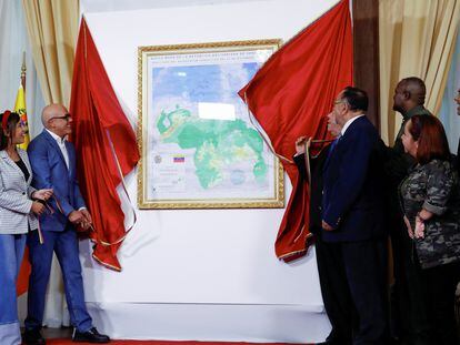 The president of Venezuela's National Assembly, Jorge Rodriguez, unveils a map of Venezuela showing the disputed Esequibo region as part of the country.