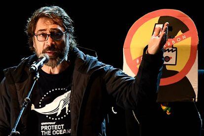 Spanish actor Javier Bardem speaks onstage during the climate march to demand urgent action on the climate crisis from world leaders attending the COP25 summit, in Madrid.