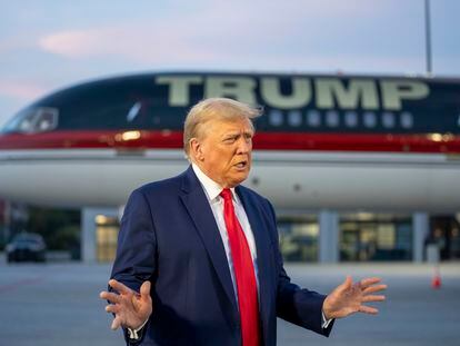Former President Donald Trump speaks with reporters before departure from Hartsfield-Jackson Atlanta International Airport, Thursday, Aug. 24, 2023, in Atlanta.