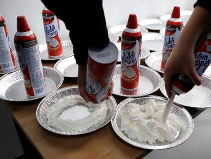College students prepare cakes with whipped cream for a party in Hamtramck, Michigan, in 2017.