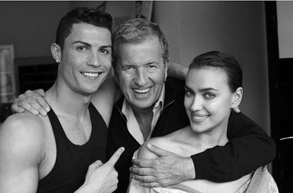 Fashion photographer Mario Testino between Cristiano Ronaldo and Irina Shayk.