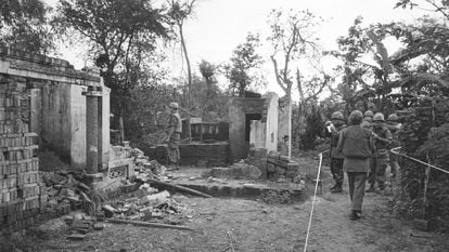 American soldiers look over the remains of a home in My Lai, South Vietnam, in this Jan. 8, 1970 file photo, two years after the massacre.