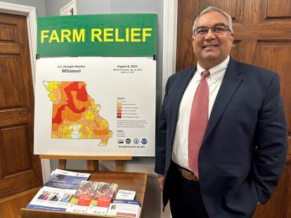 Missouri Treasurer Vivek Malek stands near a poster promoting drought conditions and state aid programs on Jan. 4, 2024, at his Capitol office in Jefferson City, Mo.