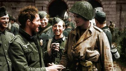 A German soldier and a US GI greet each other after the end of the Second World War.