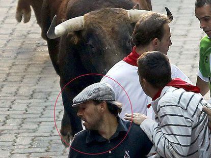 This runner managed to hold onto his hat at Friday’s Running of the Bulls.