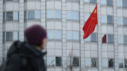 A woman walks in front of the Chinese Embassy in Berlin in December 2017, when Germany accused China of espionage and trying to recruit agents.