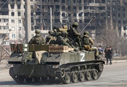 Russian soldiers on a tank with the letter Z painted on it, in Mariupol on March 24.