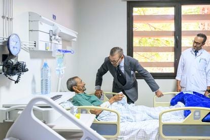 The king visits one of those injured by the earthquake at the Mohammed VI University Hospital in Marrakech on September 12.
