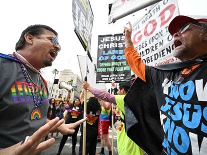 A man argues with an anti-gay religious protestor (R) at the 2023 LA Pride Parade on June 11, 2023 in Hollywood, California.