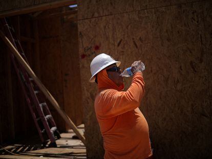 A worker takes a break from working at a construction site during a heat wave in Arizona, on July 28, 2023.