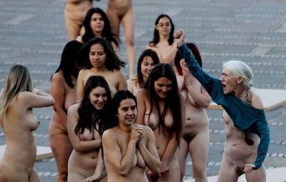 Women participating in a nude group photo.