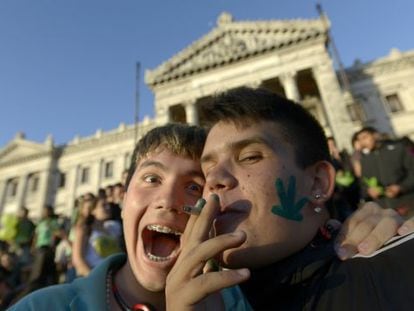 Activists share a joint in front of the Senate in Montevideo.
