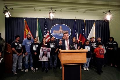 Family of those killed by a gunman at Robb Elementary School in Uvalde, Texas, stand with Texas State Sen. Roland Gutierrez, center, during a news conference at the Texas Capitol in Austin, Texas, on Jan. 24, 2023