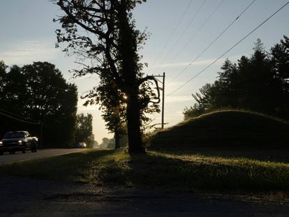 Cars drive along a road near one of the Twin Mounds, at right, at Fort Ancient Earthworks, on Sept. 19, 2023, in Oregonia, Ohio.