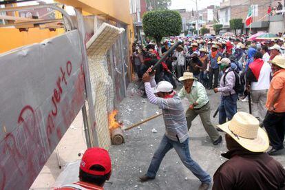Protestors in Chilpancingo, Mexico vandalize the local headquarters of the Democratic Revolutionary Party on Wednesday. 