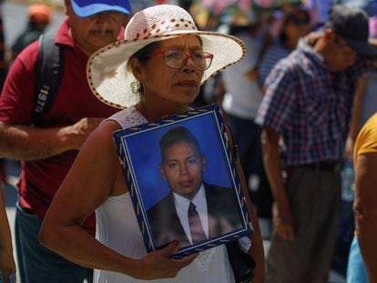 Activists and families participate in a protest to demand the release of detainees held during the state of emergency in San Salvador on August 16.