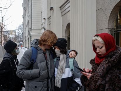 People gather outside the building of Russia’s Supreme Court following a hearing to consider the LGBTQ movement as extremist in Moscow, Russia, November 30, 2023.