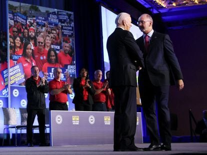 U.S. President Joe Biden is greeted by United Auto Workers (UAW) President Shawn Fain after Fain endorsed Biden for president in Washington, January 24, 2024.