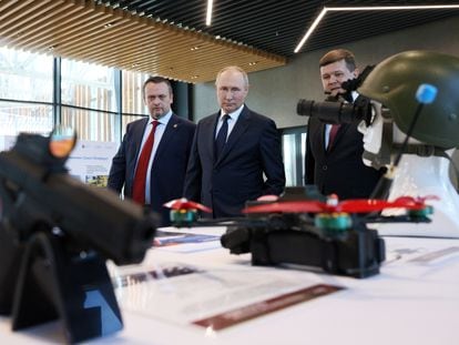Russian President Vladimir Putin (center) visits an exhibition at the Novgorod Technical College on Wednesday.