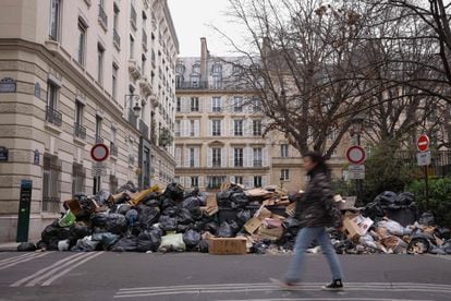 This photograph taken on March 13 in Paris, 2023, shows waste that has been piling up on the pavement as waste collectors are on strike since March 6 against the French government's proposed pensions reform.